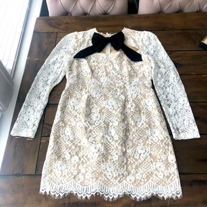 White lace mini dress w black pussybow